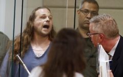 Jeremy Joseph Christian shouts as he is arraigned in Multnomah County Circuit Court in Portland, Ore., Tuesday, May 30, 2017. (Beth Nakamura/The Oregonian via AP, Pool)
