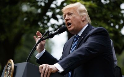 President Donald Trump speaks in the Rose Garden of the White House in Washington, Thursday, May 4, 2017, before signing an executive order aimed at easing an IRS rule limiting political activity for churches. (AP Photo/Evan Vucci)