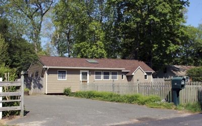 This May 18, 2017 photo shows one of 40 homes in a community run by the German American Settlement League in Yaphank, N.Y. The organization has settled a case with New York's attorney general, who claimed the GASL was not complying with state and federal fair housing laws because it had restricted ownership of homes to people of German descent. (AP Photo/Frank Eltman).