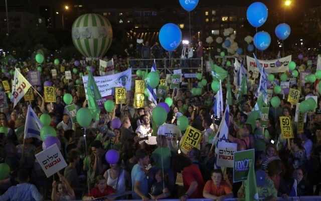 Israelis participate in a pro-peace rally in Tel Aviv, May 27, 2017. Yellow signs read: '50 years is enough, peace now' (AP Photo/Oded Balilty) Israelis participate in a pro-peace rally in Tel Aviv, May 27, 2017. Yellow signs read: '50 years is enough, peace now' (AP Photo/Oded Balilty)