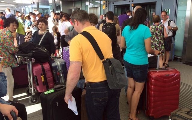 Passengers stand with their luggage outside Terminal 5 at London's Heathrow airport after flights were canceled due to the airport suffering an IT systems failure, May 27, 2017. (AP/Jo Kearney) Passengers stand with their luggage outside Terminal 5 at London's Heathrow airport after flights were canceled due to the airport suffering an IT systems failure, May 27, 2017. (AP/Jo Kearney)