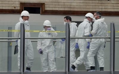 Forensic officers work near the Manchester Arena in Manchester, Wednesday, May 24, 2017. (AP/Kirsty Wigglesworth)