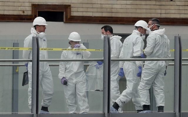 Forensic officers work near the Manchester Arena in Manchester, Wednesday, May 24, 2017. (AP/Kirsty Wigglesworth)