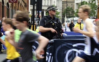 Armed police on guard during the Great Manchester Run in Manchester, England, May 28, 2017. (AP/Rui Vieira)
