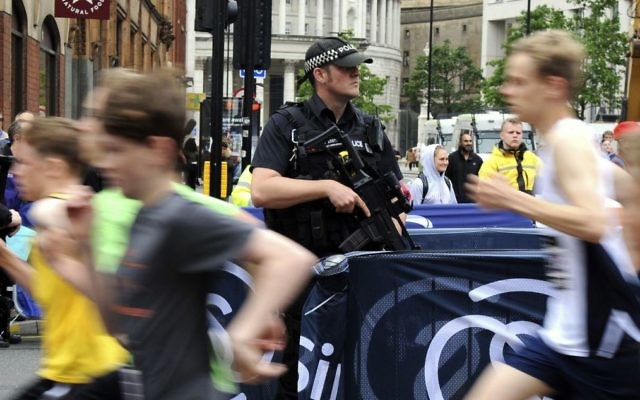 Armed police on guard during the Great Manchester Run in Manchester, England, May 28, 2017. (AP/Rui Vieira) Armed police on guard during the Great Manchester Run in Manchester, England, May 28, 2017. (AP/Rui Vieira)