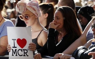 People attend a vigil in Albert Square, Manchester, England, May 23, 2017, the day after the suicide attack at an Ariana Grande concert that left 22 people dead. (AP Photo/Kirsty Wigglesworth)