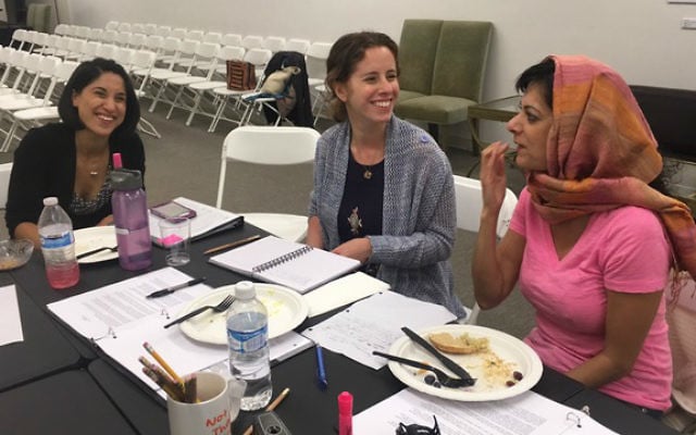 Tiffany Mualem, Ayelette Robinson and Aneela Qureshi discuss script changes during a 
rehearsal break for 'More Courage.' (Courtesy JWT)