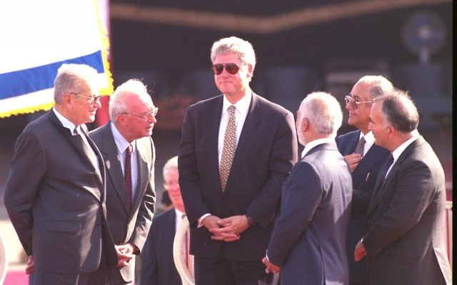 US President Bill Clinton, with sun glasses, together with President Ezer Weizman, Prime Minister Yitzchak Rabin, and Jordan's King Hussein after the Israeli-Jordanian peace treaty was signed in the Arava desert, October 1994 (Avi Ohayon/GPO)