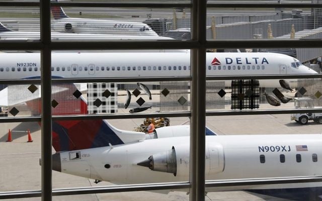 Illustrative image of Delta Air Lines planes parked at Ronald Reagan Washington National Airport, in Washington, Aug. 8, 2016. (AP Photo/Carolyn Kaster) Illustrative image of Delta Air Lines planes parked at Ronald Reagan Washington National Airport, in Washington, Aug. 8, 2016. (AP Photo/Carolyn Kaster)