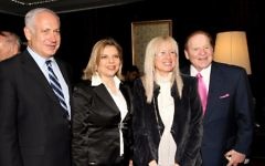 American billionaire businessman Sheldon Adelson (R) and his wife Miriam meet Benjamin Netanyahu and his wife Sara at the International Conference Center in Jerusalem, May 13, 2008. (Anna Kaplan/Flash90/File)