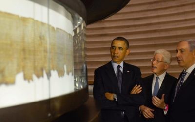 Then-US president Barack Obama and Prime Minister Benjamin Netanyahu examine the Dead Sea Scrolls, in the Shrine of the Book at the Israel Museum, during Obama's visit to Israel in March 2013. (Amos Ben Gershom/GPO/Flash90)