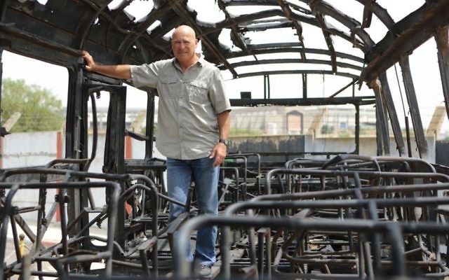 Former Israel Police commissioner Assaf Hefetz stands inside the remains of a bus from a 1978 terror attack known as the Coastal Road Massacre, in a museum in Holon, on May 2, 2013. (Yaakov Naumi/Flash90) Former Israel Police commissioner Assaf Hefetz stands inside the remains of a bus from a 1978 terror attack known as the Coastal Road Massacre, in a museum in Holon, on May 2, 2013. (Yaakov Naumi/Flash90)