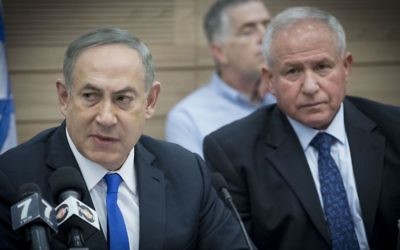 Prime Minister Benjamin Netanyahu, left, and Head of the Defense and the then Foreign Affairs Committee MK Avi Dichter in the Knesset, March 8, 2017. (Yonatan Sindel/Flash90)
