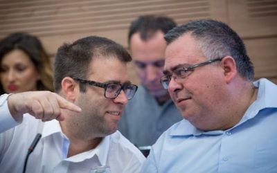 Likud parliament members Oren Hazan and David Bitan attend a committee meeting in Knesset on March 15, 2017. (Miriam Alster/Flash90)