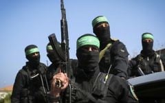 Masked Hamas terrorists attend the funeral of Mazen Fuqha in Gaza City, March, 25 2017. (Abed Rahim Khatib/Flash90)