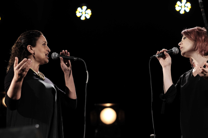 Jewish Israeli singer Ahinoam Nini, left, and Arab Israeli singer Mira Awad, right, perform at an Israeli-Palestinian memorial ceremony in Tel Aviv on April 30, 2017, as Israel marks its annual Memorial Day for fallen soldiers and victims of terror. (Tomer Neuberg/Flash90) Jewish Israeli singer Ahinoam Nini, left, and Arab Israeli singer Mira Awad, right, perform at an Israeli-Palestinian memorial ceremony in Tel Aviv on April 30, 2017, as Israel marks its annual Memorial Day for fallen soldiers and victims of terror. (Tomer Neuberg/Flash90)
