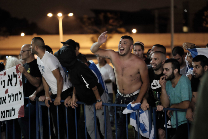 Right-wing activists protest outside an Israeli-Palestinian memorial ceremony in Tel Aviv on April 30, 2017, as Israel marks its annual Memorial Day for fallen soldiers and victims of terror. (Tomer Neuberg/Flash90) Right-wing activists protest outside an Israeli-Palestinian memorial ceremony in Tel Aviv on April 30, 2017, as Israel marks its annual Memorial Day for fallen soldiers and victims of terror. (Tomer Neuberg/Flash90)