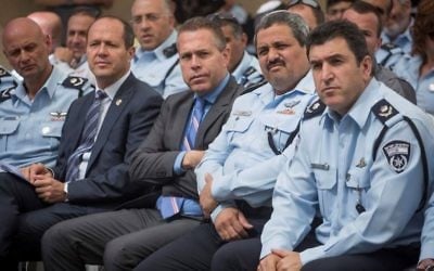 Public Security Minister Gilad Erdan (C), Police Commissioner Roni Alsheich (2nd-R), Jerusalem Police Chief Yoram Halevi (R) and Jerusalem Mayor Nir Barkat (2nd-L) attend the opening ceremony of the new police station in the Shuafat refugee camp in East Jerusalem on May 7, 2017.(Hadas Parush/Flash90)