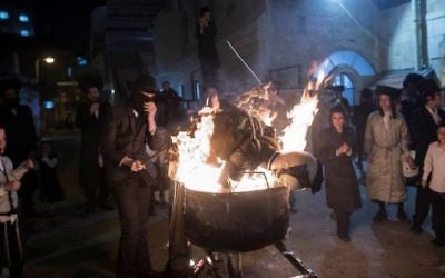 Ultra-Orthodox Jews burn an effigy of an IDF soldier during Lag B'Omer celebrations in the ultra-orthodox neighborhood of Mea She'arim in Jerusalem on May 13, 2017. (Noam Revkin Fenton/Flash90)