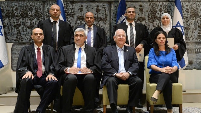 New qadis, or religious judges, pose for a picture at the President's residence, on May 15, 2017 with President Reuben Rivlin and Justice Minister Ayelet Shaked. (Mark Neyman/GPO) New qadis, or religious judges, pose for a picture at the President's residence, on May 15, 2017 with President Reuben Rivlin and Justice Minister Ayelet Shaked. (Mark Neyman/GPO)