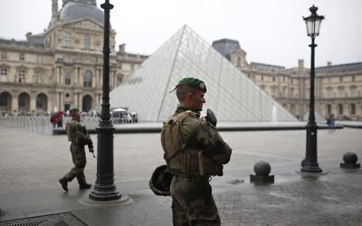 Soldiers patrol in the courtyard of the Louvre museum in Paris, France Sunday, May 7, 2017. (AP Photo/Kamil Zihnioglu)