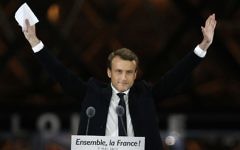 French President-elect Emmanuel Macron gestures during a victory celebration outside the Louvre museum in Paris, France, on Sunday, May 7, 2017. (AP Photo/Thibault Camus)