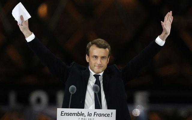 French President-elect Emmanuel Macron gestures during a victory celebration outside the Louvre museum in Paris, France, on Sunday, May 7, 2017. (AP Photo/Thibault Camus)