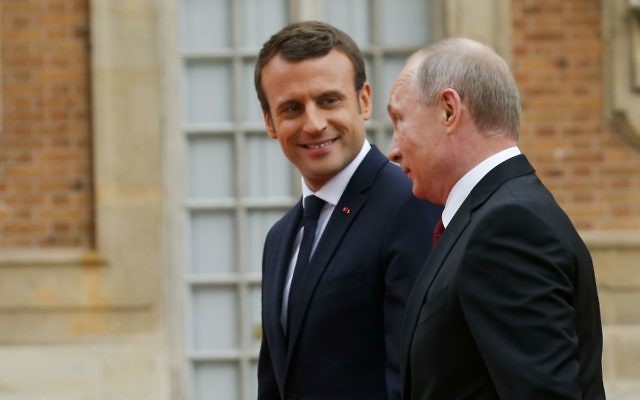 Russian President Vladimir Putin, right, and French President Emmanuel Macron, left, at the Palace of Versailles, near Paris, France, Monday, May 29, 2017. (AP Photo/Alexander Zemlianichenko, pool)