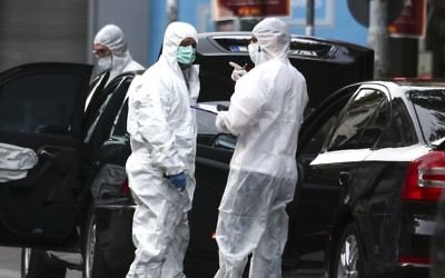 Greek police experts search for evidence at the scene of an explosion site in Athens, on Thursday, May 25, 2017.  (AP Photo/Yorgos Karahalis)