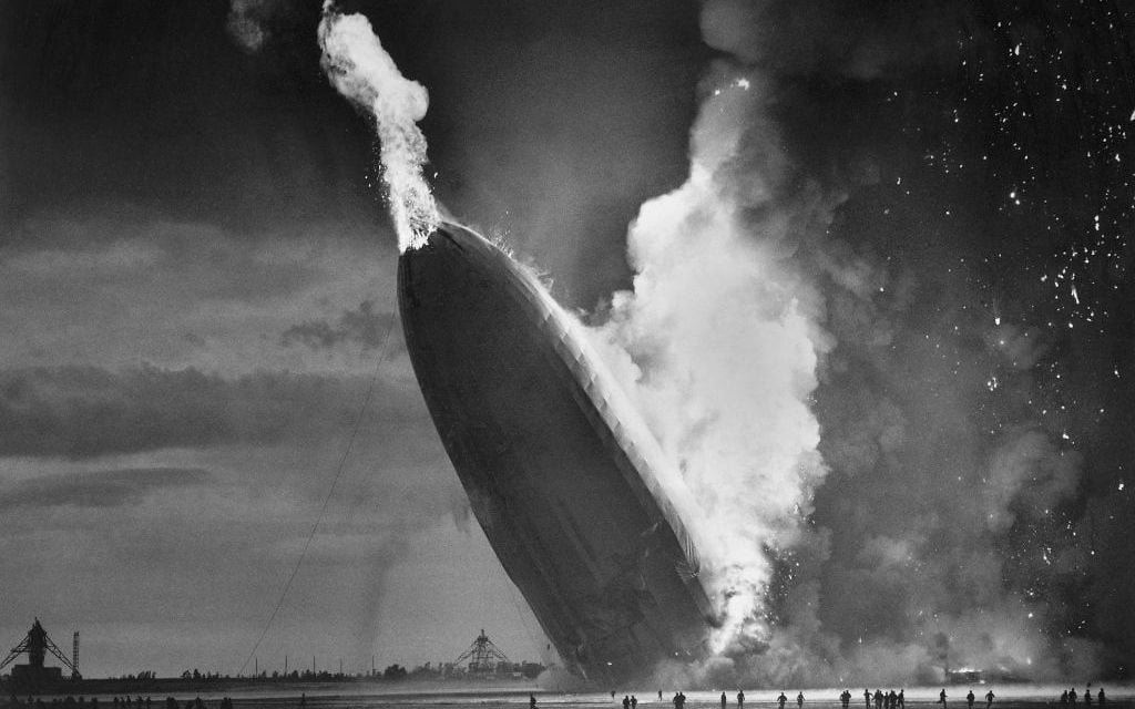 In this May 6, 1937 photo, the German dirigible Hindenburg crashes to earth in flames after exploding at the U.S. Naval Station in Lakehurst, N.J.  (AP Photo/Murray Becker, File)