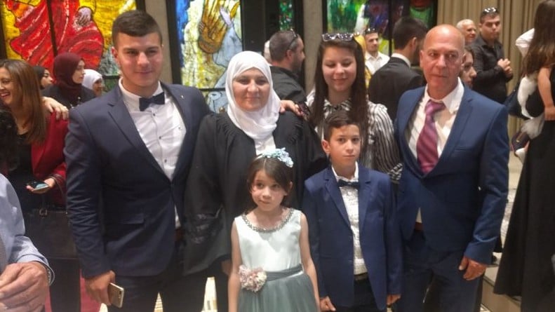 Hana Mansour Khatib, the first female qadi, or religious judge, with her family at her installation ceremony at the presidential residence in Jerusalem on May 15, 2017. (Melanie Lidman/Times of Israel) Hana Mansour Khatib, the first female qadi, or religious judge, with her family at her installation ceremony at the presidential residence in Jerusalem on May 15, 2017. (Melanie Lidman/Times of Israel)