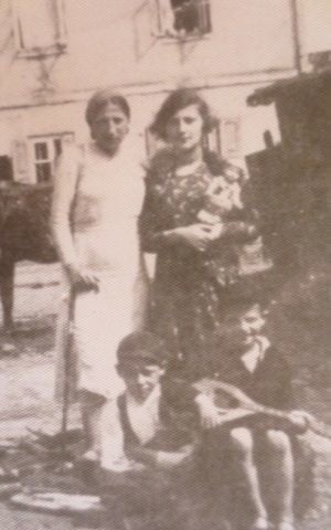 Ben Stern, front right, as a child in Europe, holding a mandolin. (Courtesy)