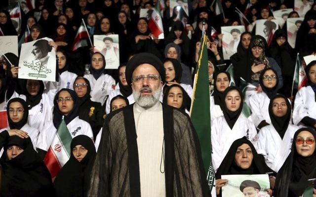 Iranian cleric and presidential candidate Ebrahim Raisi, center, stands among his supporters, during a campaign rally in Tehran, Iran, April 29, 2017. (AP/Ebrahim Noroozi)