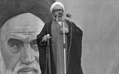 FILE -- In this November 23, 1979 file photo, then President of Iran's Ruling Revolutionary Council, Ayatollah Hossein Ali Montazeri holds a rifle as he addresses a large rally at Tehran University. (AP, File)
