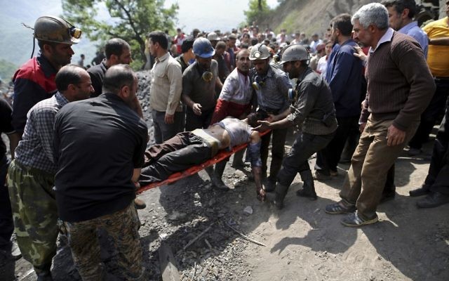 In this picture released by the Tasnim News Agency, miners and rescue personnel carry an injured mine worker after a coal mine explosion, near Azadshahr in northern Iran, Wednesday, May, 3, 2017. (AP/Tasnim News Agency, Mostafa Hassanzadeh) In this picture released by the Tasnim News Agency, miners and rescue personnel carry an injured mine worker after a coal mine explosion, near Azadshahr in northern Iran, Wednesday, May, 3, 2017. (AP/Tasnim News Agency, Mostafa Hassanzadeh)