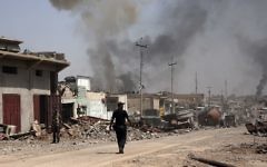 In this Tuesday, May 9, 2017 file photo, smoke rises during heavy fighting between Islamic State militants and Iraqi special forces in the industrial area of west Mosul, Iraq. (AP Photo/Maya Alleruzzo, File)