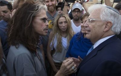 Newly arrived Ambassador to Israel David Friedman speaks with Aerosmith singer Steven Tyler at the Western Wall, the holiest site where Jews can pray in Jerusalem's Old City, Monday, May 15, 2017. (AP Photo/Sebastian Scheiner) 