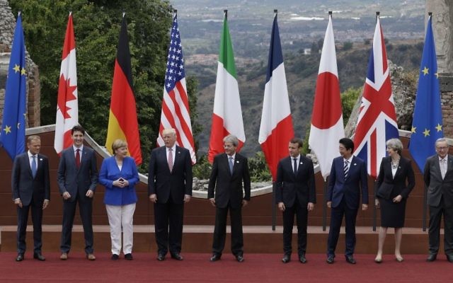 US President Donald Trump is surrounded by security guards as he arrives for a welcome ceremony for the G7 summit in the Ancient Theatre of Taormina (3rd century BC) in the Sicilian citadel of Taormina, Italy, May 26, 2017. (AP Photo/Gregorio Borgia) US President Donald Trump is surrounded by security guards as he arrives for a welcome ceremony for the G7 summit in the Ancient Theatre of Taormina (3rd century BC) in the Sicilian citadel of Taormina, Italy, May 26, 2017. (AP Photo/Gregorio Borgia)