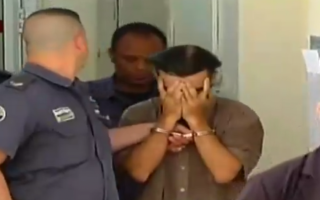 One of the suspects in the murder of Jerusalem resident Shlomo Sami Marciano is seen being led into court. (Screen capture: Channel 2) One of the suspects in the murder of Jerusalem resident Shlomo Sami Marciano is seen being led into court. (Screen capture: Channel 2)
