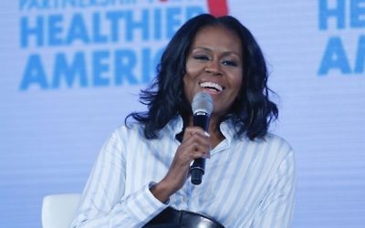 Former first lady Michelle Obama smiles while speaking at the Partnership for a Healthier American 2017 Healthier Future Summit in Washington, Friday, May 12, 2017. (AP Photo/Pablo Martinez Monsivais)