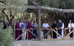 The Archbishop of Canterbury, Justin Welby, center left, visits the archaeological site al-Maghtas in Jordan Wednesday  believed to be the place where John the Baptist baptized Jesus of Nazareth on May, 3, 2017. (AP Photo/Sam McNeil)