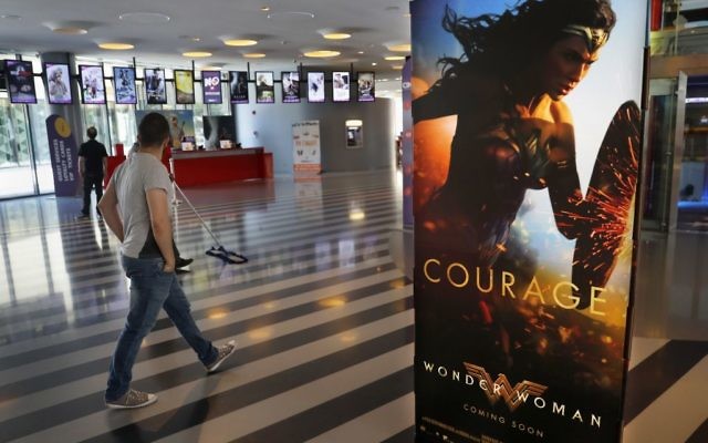 A man walks past a poster promoting the movie, Wonder Woman, at a cinema in downtown Beirut, Lebanon, Tuesday, May 30, 2017. (AP Photo/Hussein Malla) A man walks past a poster promoting the movie, Wonder Woman, at a cinema in downtown Beirut, Lebanon, Tuesday, May 30, 2017. (AP Photo/Hussein Malla)