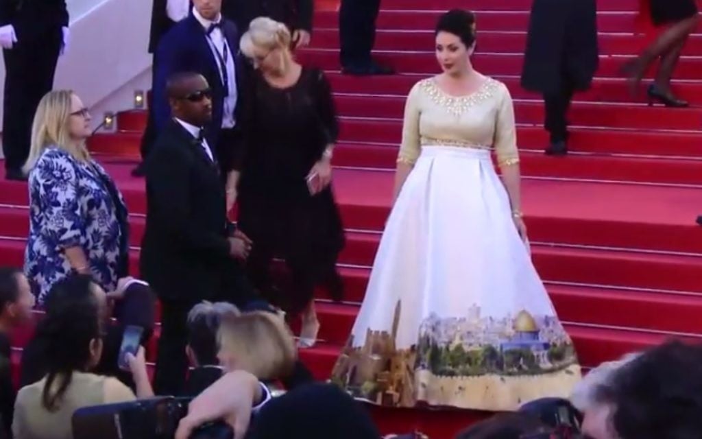 Culture Minister Miri Regev (R) wears a specially- designed Jerusalem dress to the Cannes Film Festival, May 17, 2017 (Screen capture: Channel 10)