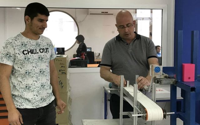 Moona student Yazan Kiwan with instructor Ron Strugo (Shoshanna Solomon)
