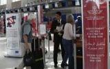 In this photo dated Thursday, March 29, 2017, airport staff inform passengers at the check-in area at Casablanca Mohammed V International Airport, Morocco of the ban on in-flight laptops and tablets.  (AP Photo/ Abdeljalil Bounhar)