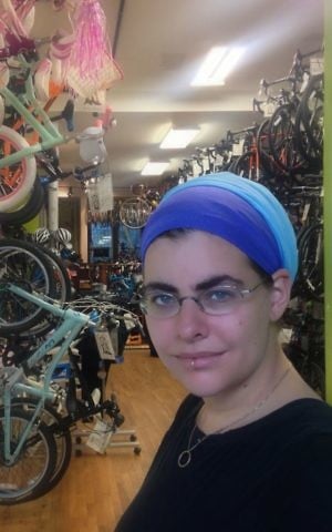 Nechama Levy, who participates in a few Crown Heights independent prayer groups, is involved in another Brooklyn trend: Her bike shop, Bicycle Roots, is also in the neighborhood. (Courtesy of Levy/via JTA)