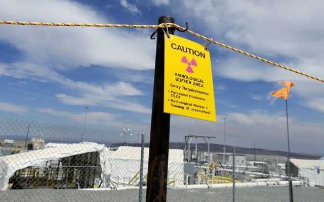 In this July 9, 2014, file photo, a sign warns of radioactivity near a wind direction flag indicator at the "C" tank farm on the Hanford Nuclear Reservation near Richland, Wash. (AP Photo/Ted S. Warren, file) In this July 9, 2014, file photo, a sign warns of radioactivity near a wind direction flag indicator at the "C" tank farm on the Hanford Nuclear Reservation near Richland, Wash. (AP Photo/Ted S. Warren, file)