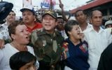 In this May 2, 1989 file photo, Gen. Manuel Antonio Noriega walks with supporters in the Chorrilo neighborhood, where he dedicated a new housing project, in Panama City. (AP/John Hopper, File)