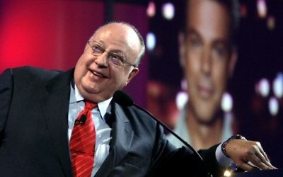In this July 24, 2006 file photo, Roger Ailes, chairman and chief executive officer of Fox News, listens as anchor Shepard Smith, seen on screens in front and behind him, as Smith talks to the audience via satellite from Israel, at the Summer Television Critics Association Press Tour in Pasadena, Calif. Fox News said on Thursday, May 18, 2017, that Ailes has died. He was 77. (AP Photo/Reed Saxon)