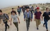Jews from around the world along with Israelis and Palestinians make their way to the site of the Sumud Freedom Camp in the South Hebron Hills on May 19, 2017. (Credit: Gili Getz)